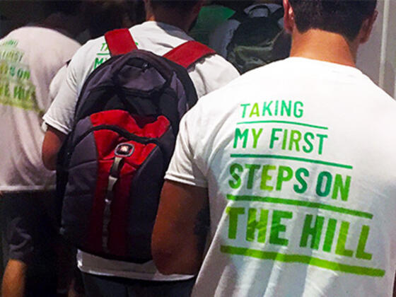 Picture of the back of a t-shirt that reads: Taking My First Steps on the Hill