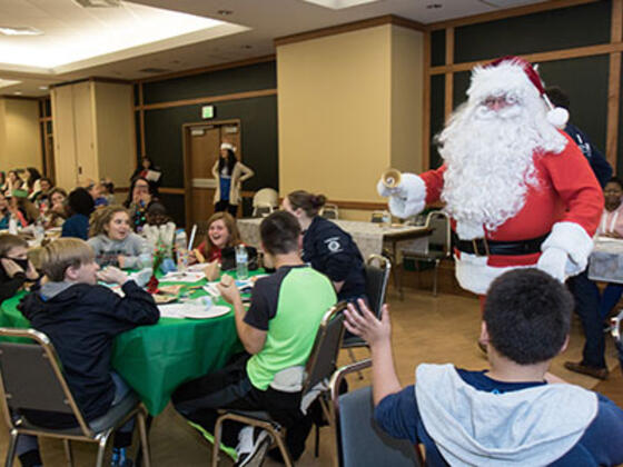 Santa pays a visit to Boys & Girls Club members at the holiday party hosted by McDaniel College