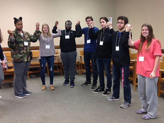 McDaniel College students in Priciples of Biology class form a human chain of amino acids to learn about proteins