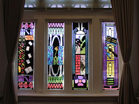 Photo of stained glass panels created by students for "Views of McDaniel" art exhibition