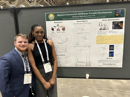 Matt Denny and Makela Brown pose with their presented research poster for the ACS conference