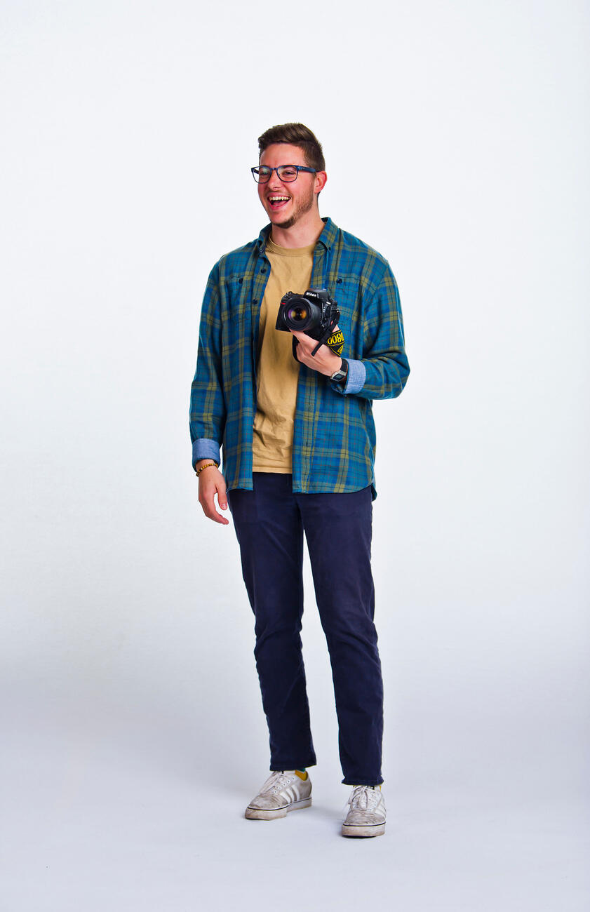 Erik Yanisko holding camera.