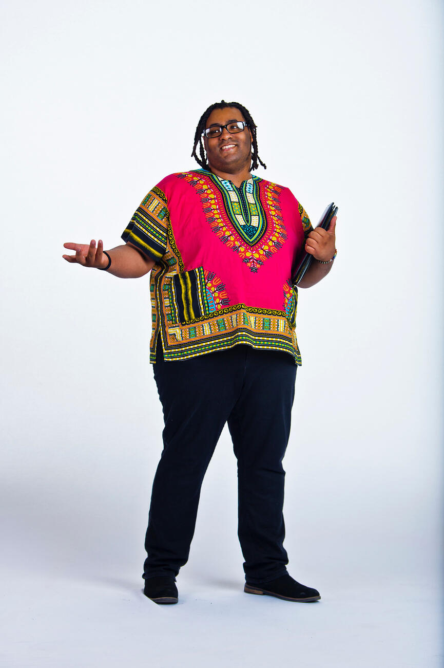 Wayne Young standing in front of a white background.