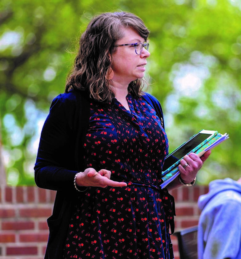 Photo of professor Katie Staab in profile standing outside.