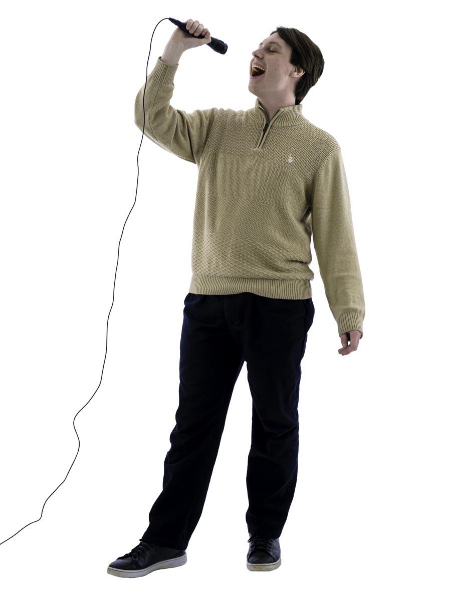 Paul Steinert sings into microphone