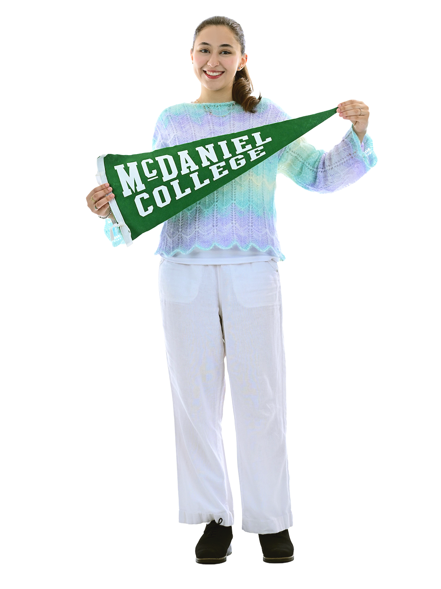 Hira Kahn holding a McDaniel pennant