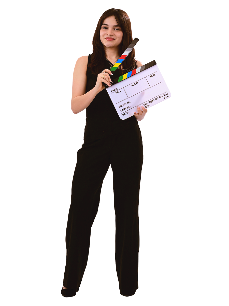A female student wearing all black poses with a film slate.