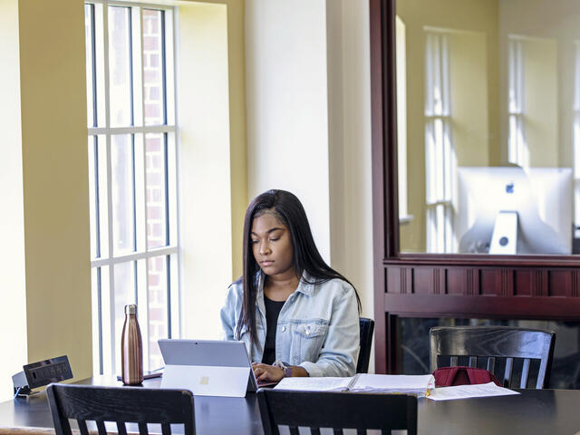 Student in Hoover Library.
