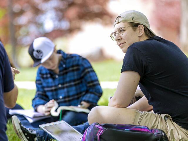 Students in outdoor classroom setting.