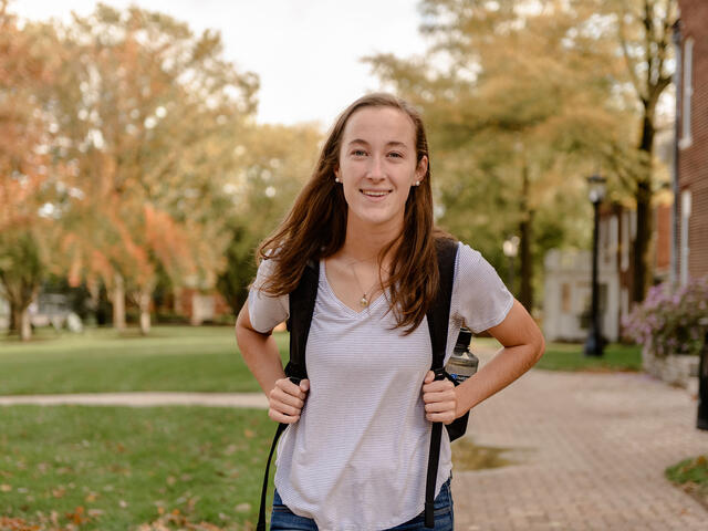 Student walking across campus.