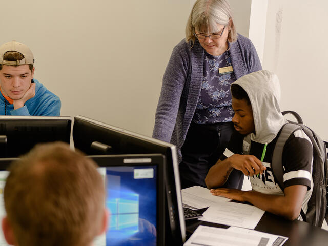 Professor interacting with students.