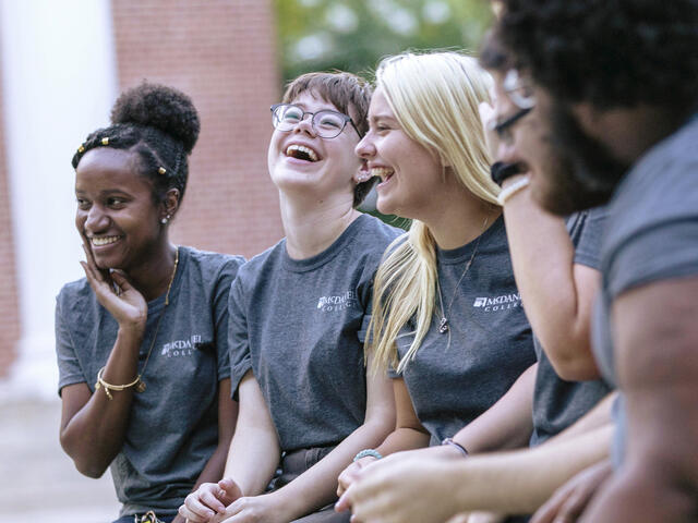 McDaniel Local crew sitting together on campus.