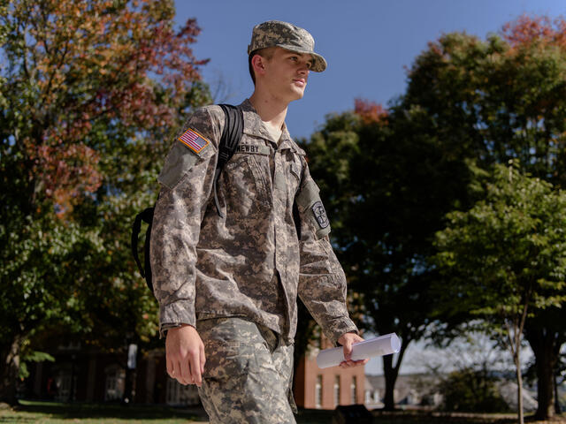 ROTC student walking across campus.