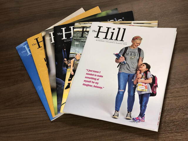 The Hill magazine covers stacked on table.
