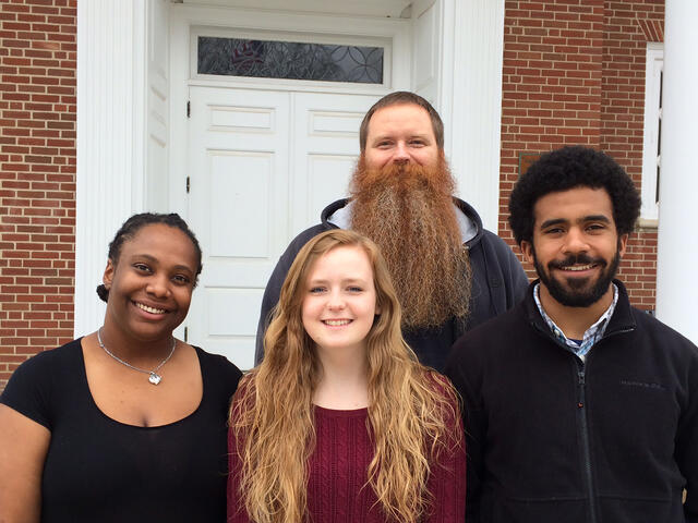 Religious Studies professor Brad Stoddard with students presenting on Religion and Race at national conference