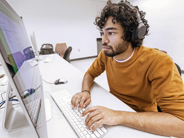Student using a computer in a computer lab.