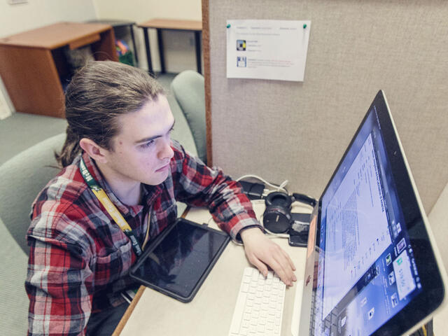 Student working on computer.