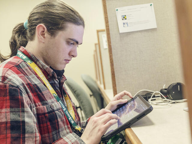 Student working on computer.