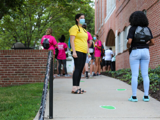 students talking wearing masks
