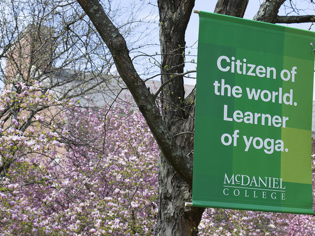 campus sign - Citizen of the World. Learner of Yoga. McDaniel College.