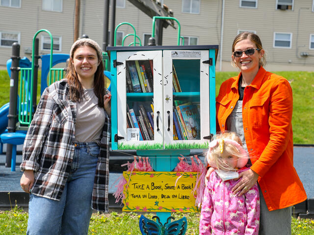 Gia K. with professor Chloe Irla at the new little free library on Charles Street.