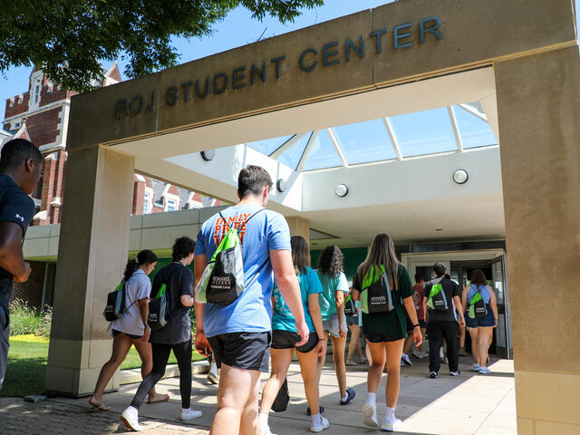 Students walking into Roj Student Center.