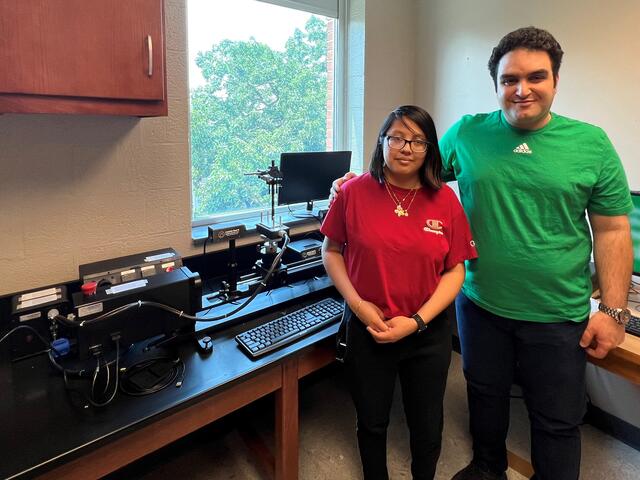 Professor Farzad Ahmadi stands with student Tania Mendez-Perez in the lab.