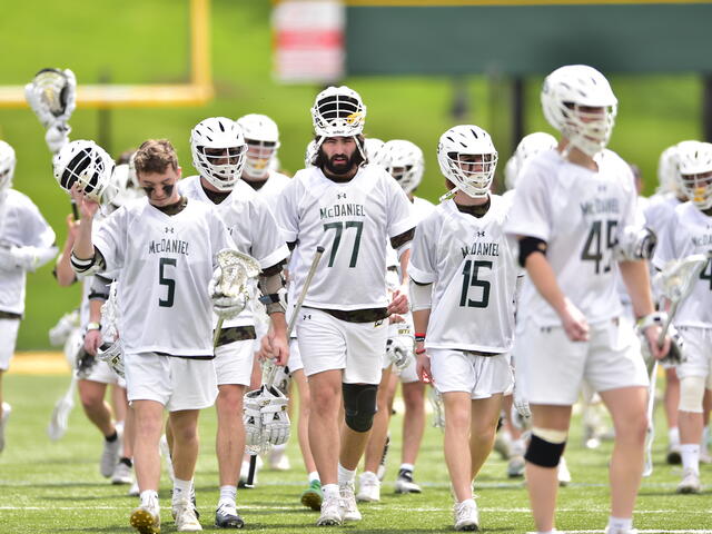 Men's Lacrosse players walking