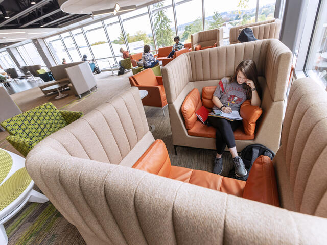 student studying in roj student center