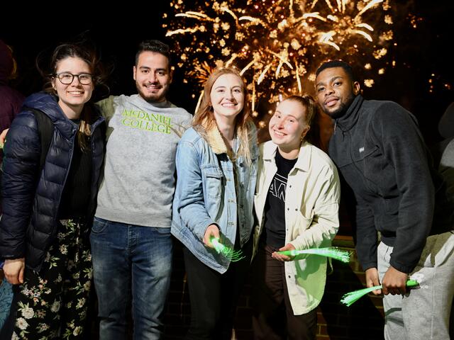 Group of students with fireworks
