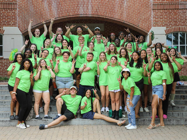 Group of students in green shirts