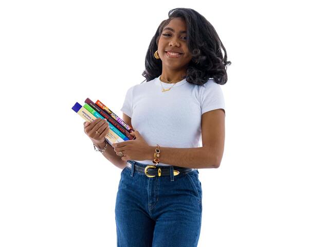 Janiah Field holding textbooks