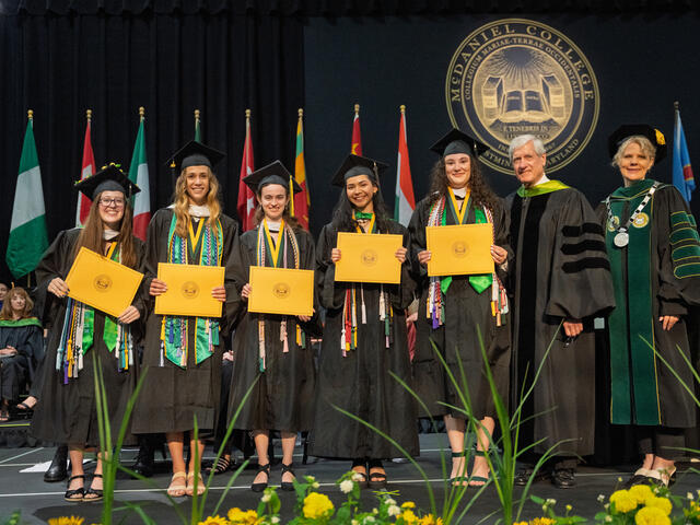 Recipients of the Argonaut Award post on stage with Board of Trustees Chair, Bruce H. Preston '75 and President Julia Jasken