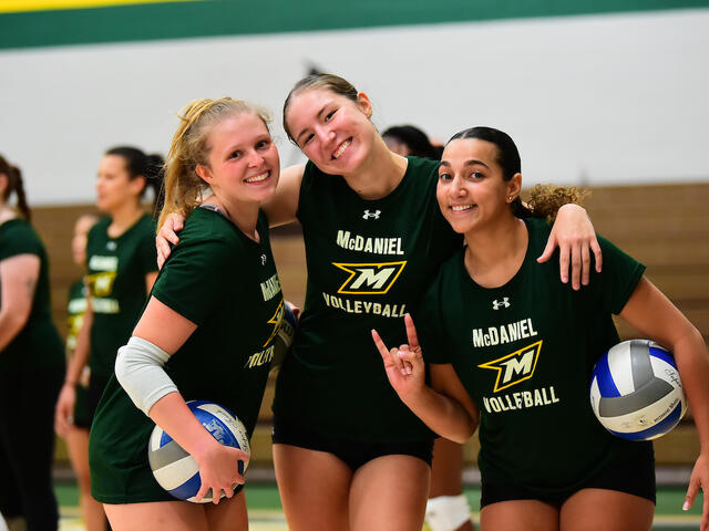 Volleyball players before a game in Fall 2024.