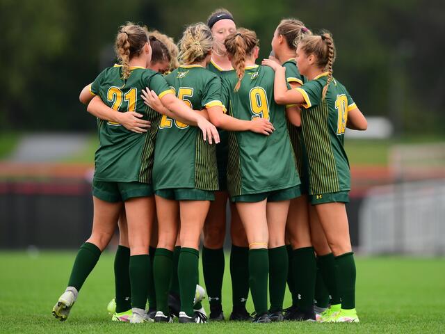 Women's Soccer huddle, 2025