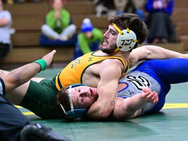 A Green Terror wrestler make the pin