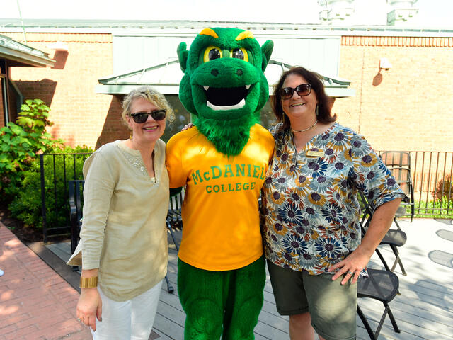 President Julia Jasken and Mayor Mona Becker pose with the Green Terror