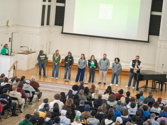 Admissions counselors on stage at a fall event. 