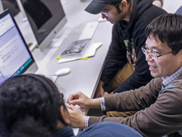 students discussing project in computer lab