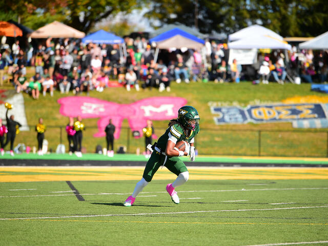 A Green Terror football player returns the opening kickoff of Homecoming 2025. 