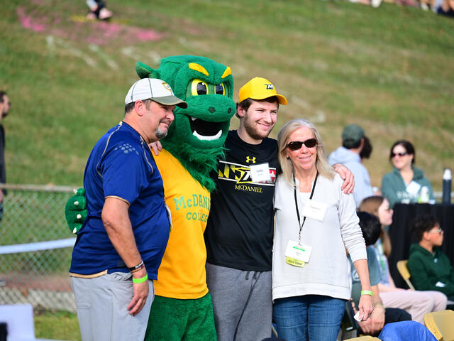 A family with the Green Terror during Parent & Family Weekend.