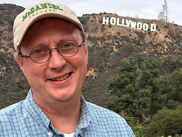 A picture of cinema and communications professor Jonathan Slade in front of the 'Hollywood' sign in California. 