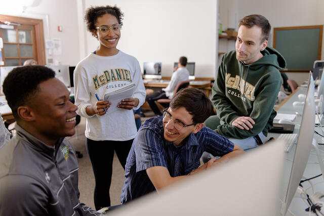 Professor interacting with students.