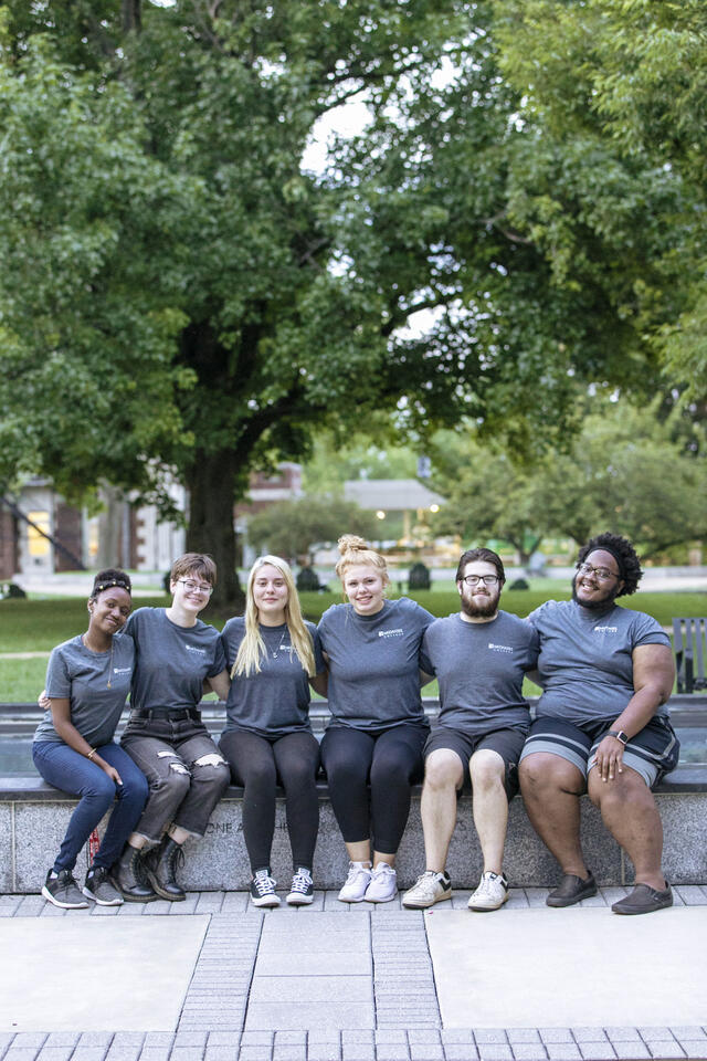 McDaniel Local crew sitting together on campus.