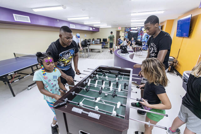 Students interacting with children at the Boys and Girls Club in Westminster.