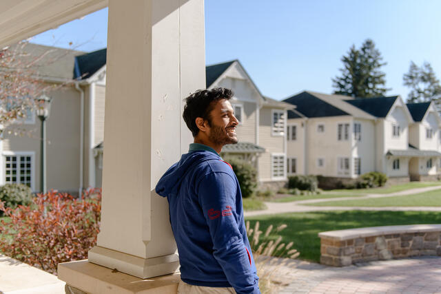 Student standing in North Village.