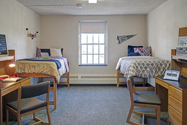 Dorm Room with beds and desks