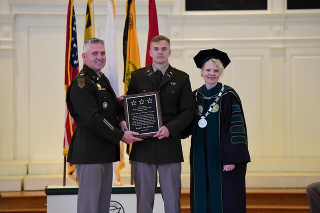 Drew Jeffries receives the Otto Guenther Leadership Award with Julia Jasken.