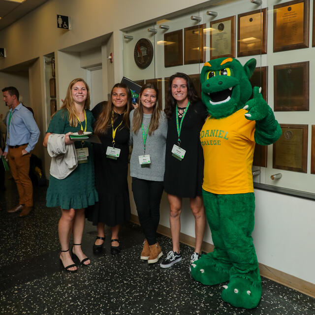 students pose with green terror