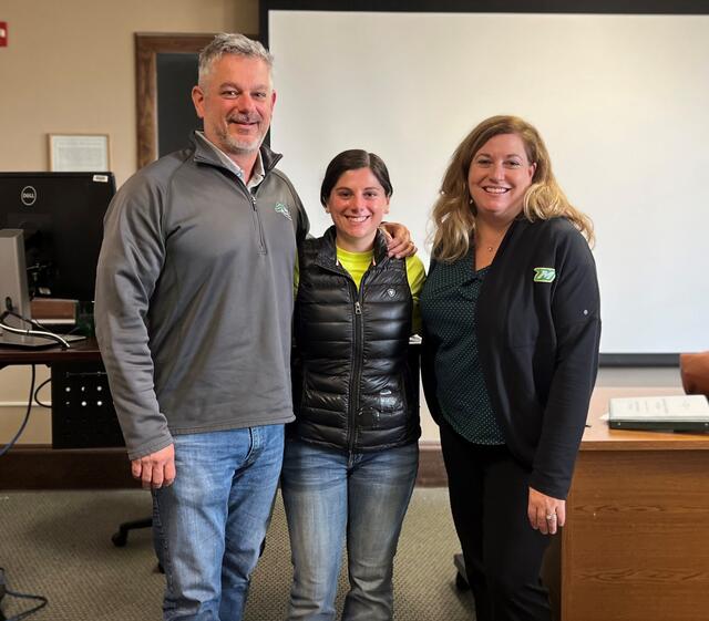 Lecturer Lori Hockley poses with alum Perri Freeman and her father Cory Freeman in an Entrepreneurship class.